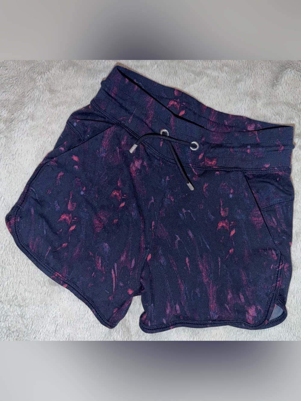 Girl’s Drawstring Athletic Shorts in Navy with Pink Accents all in motion